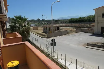 a view of a parking lot from a balcony at Casa Vacanza Accetta in Trappeto