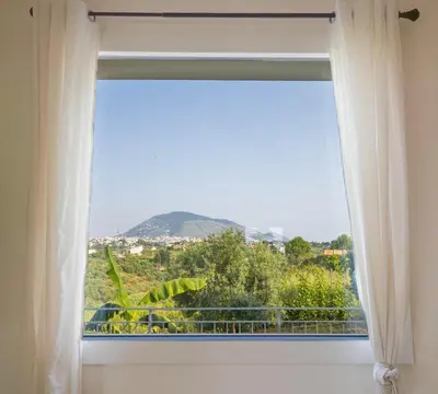 a window with a view of a mountain at Villa Arianna, il piacere di vivere nella natura. in Alcamo