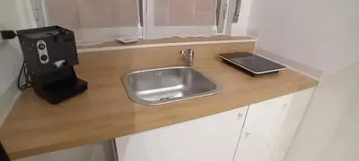 a bathroom with a sink and a toilet and a mirror at Numero Civico 2 in Palermo