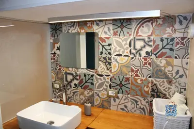 a bathroom with a sink and a mirror at Carducci Loft in Castellammare del Golfo