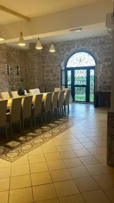 a room with chairs and a table and a window at Relais del sole in Partinico