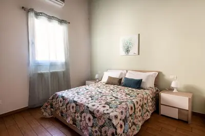 a bedroom with a bed and a window at Kalsa Apartment with Terrace by Wonderful Italy in Palermo