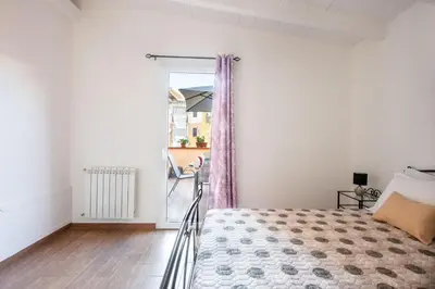 a bedroom with a bed and a window at Kalsa Apartment with Terrace by Wonderful Italy in Palermo
