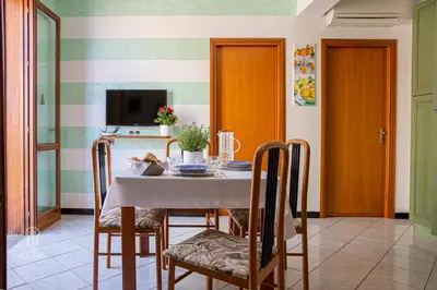 a dining room with a table and chairs at CIATU ME' Scirocco in Castellammare del Golfo