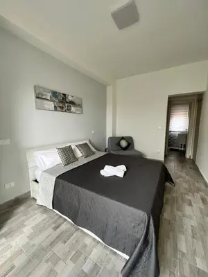 a bedroom with a large bed in a room at Il melograno in Carini