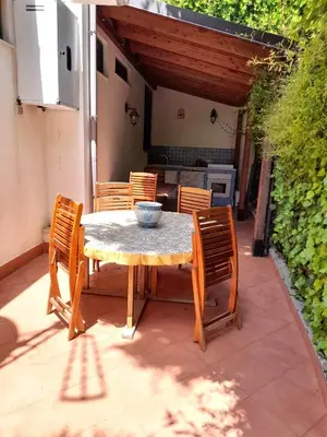 a table with chairs and a bowl on it on a patio at Belvedere in Palermo