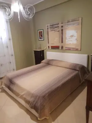 a bedroom with a large bed in a room at Belvedere in Palermo
