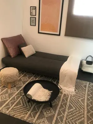 a living room with a couch and a table at EDU' in Alcamo