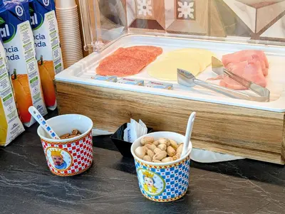 two glass containers with breads in them on a table at CI VULIA B&B - Sicilia, con colazione, piscina, barbecue, parcheggio, free wifi, sea pool and bbq in Alcamo Marina
