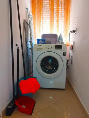 a washing machine in a laundry room with a window at Il Girasole del Centro Storico in Alcamo