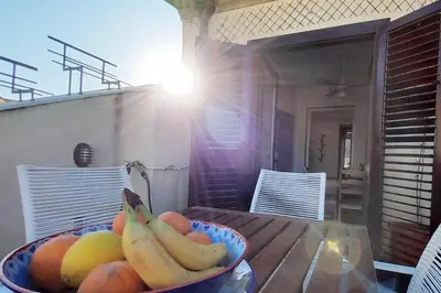 a bowl of bananas and other fruit on a table at [TERRACE WITH VIEW] Attic in old town BallarHome in Palermo