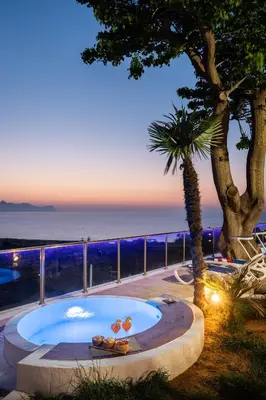 a hot tub with a view of the ocean at Villa vista mare con piscina riscaldata a Trappeto in Balestrate