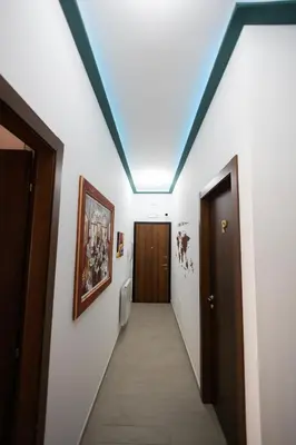 a hallway with a hallway leading to a door at PalerMonAmour Art Gallery Suite in Palermo