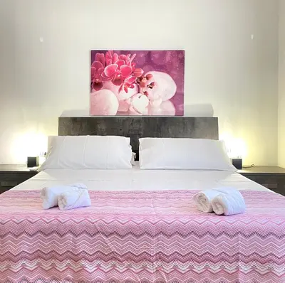 a bedroom with a bed with two towels on it at casadifederica in Palermo