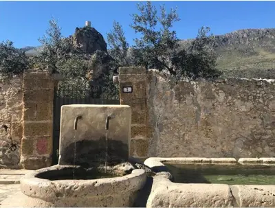 a bedroom with a bed with two towels on it at I Macaseni di Franca in Scopello