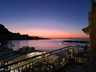 a view of a body of water at sunset at La casetta al mare in Palermo