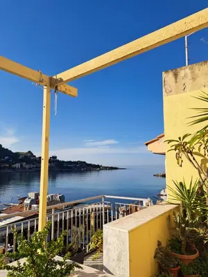 a view of the ocean from the balcony of a house at La casetta al mare in Palermo