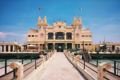 a large building with a fence in front of it at B&B Rodionoff Palermo View & Terrace Mondello-Airport Link in Palermo