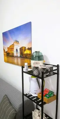 a wall with a picture of a kitchen on it at The traveler's house in Palermo