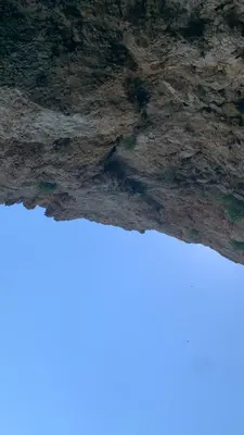 a close up of a rock wall with a blue at Mondello Addaura Addisio Suite in Palermo
