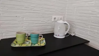 two coffee mugs and a blender on a table at Amunì in Palermo