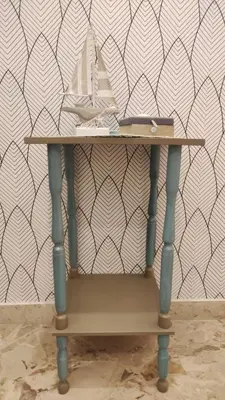 a small table in front of a wall at Amunì in Palermo