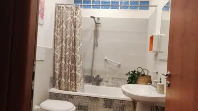 a bathroom with a sink and a toilet and a shower at Amunì in Palermo