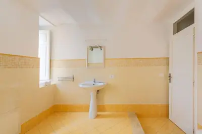 a bathroom with a sink and a mirror at Nowhere Rooms in Palermo