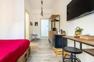 a hallway with white walls and a hard wood floor at Ai Tesori di Palermo in Palermo