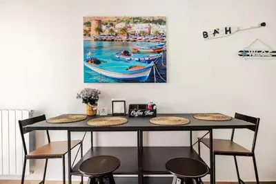 a kitchen and dining room with a table and chairs at Ai Tesori di Palermo in Palermo