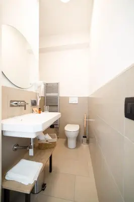 a bathroom with a sink and a toilet at Ciuri' Affittacamere in Alcamo