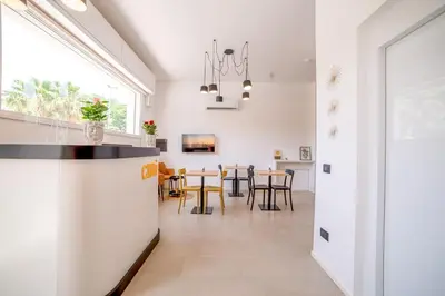 a kitchen and dining room with a table and chairs at Ciuri' Affittacamere in Alcamo
