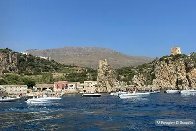 a group of boats in a body of water at A Petrazzi in Castellammare del Golfo
