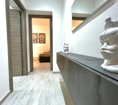 a room with a statue of a face on a counter at Casa Pascal in Palermo