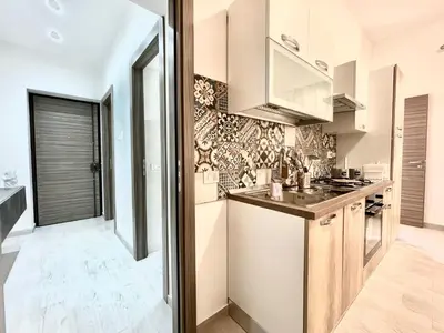 a kitchen with a sink and a stove at Casa Pascal in Palermo