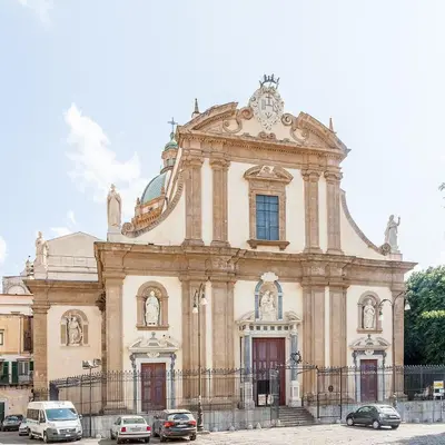 a building with cars parked in front of it at Casa Pascal in Palermo