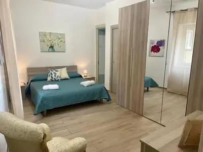 a bedroom with a bed and a large mirror at Maqueda Apartament for 4 Palermo Centre Ballarò in Palermo