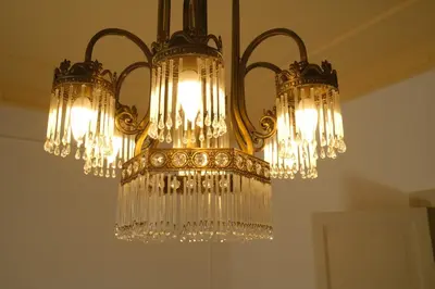 a chandelier hanging from a ceiling in a room at AUSA suites in Palermo