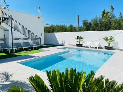 a swimming pool in the backyard of a house at Katy's Holiday House, Private Villa and Pool in Terrasini
