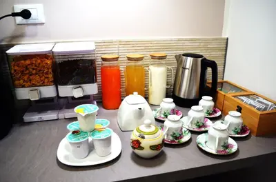 a kitchen counter with plates and pitchers of food at B&B Casa Canali in Palermo