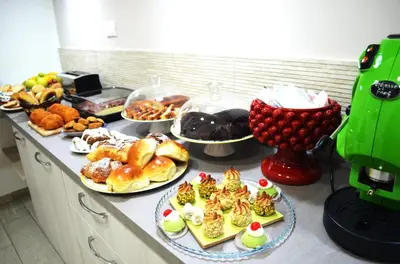 a buffet with many different types of food on a counter at B&B Casa Canali in Palermo