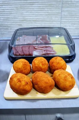 a tray with a tray of food on a table at B&B Casa Canali in Palermo