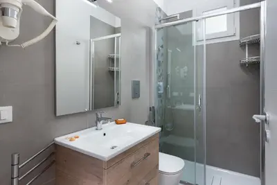 a bathroom with a sink and a shower at Savoia's apartments in San Vito lo Capo