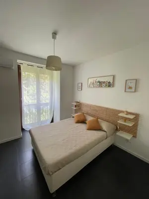 a bedroom with a large bed and a window at Zanclea in Palermo