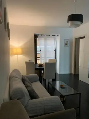 a living room with a couch and a table at Zanclea in Palermo