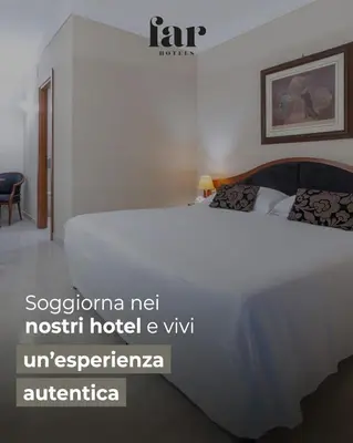 a bedroom with a large white bed in a room at Massimo Plaza Hotel in Palermo