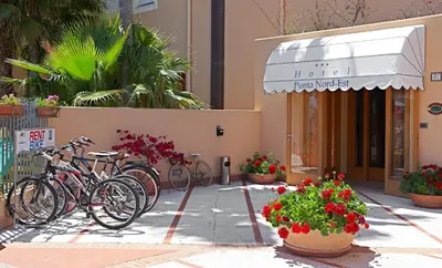 a group of bikes parked in front of a building at Hotel Punta Nord Est in Castellammare del Golfo
