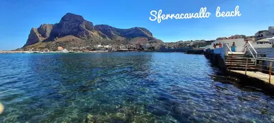 a view of the water with a mountain in the background at Casa il Bergamotto in Palermo