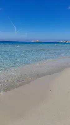 a sandy beach with the ocean in the background at Casa il Bergamotto in Palermo