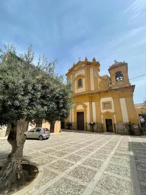 a building with a car parked in front of it at Domus Federiciana in Castellammare del Golfo